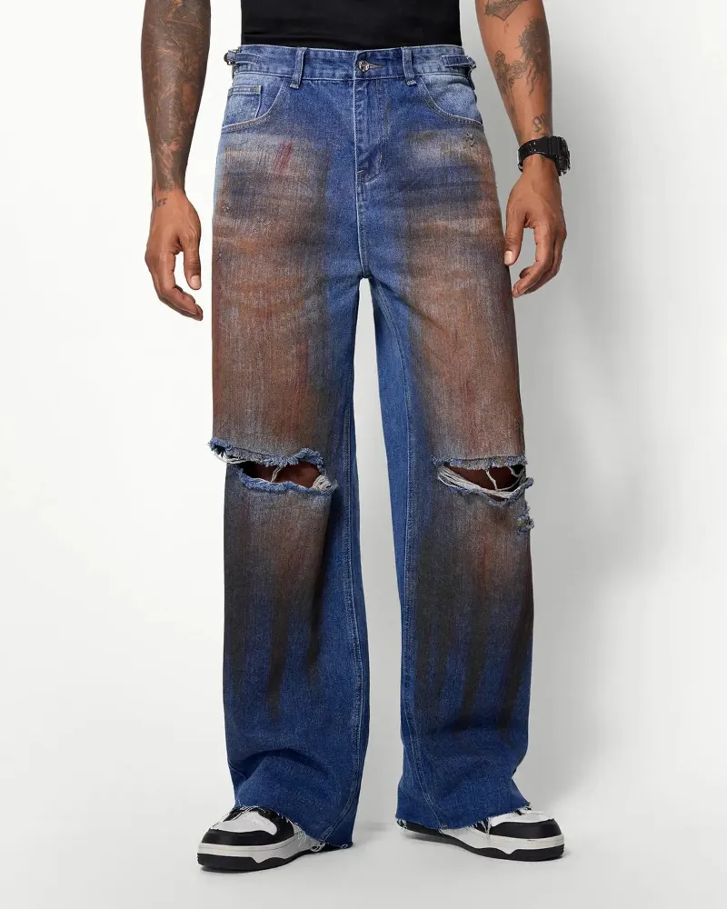 INFLATION Acid Washed Ripped Baggy Jeans in blue distressed denim with industrial-style tears