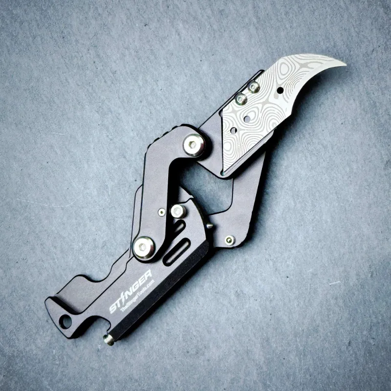 The Stinger Tools Stinger Dog Tag Blade folding pocket knife in matte black, showing closed and open blade positions