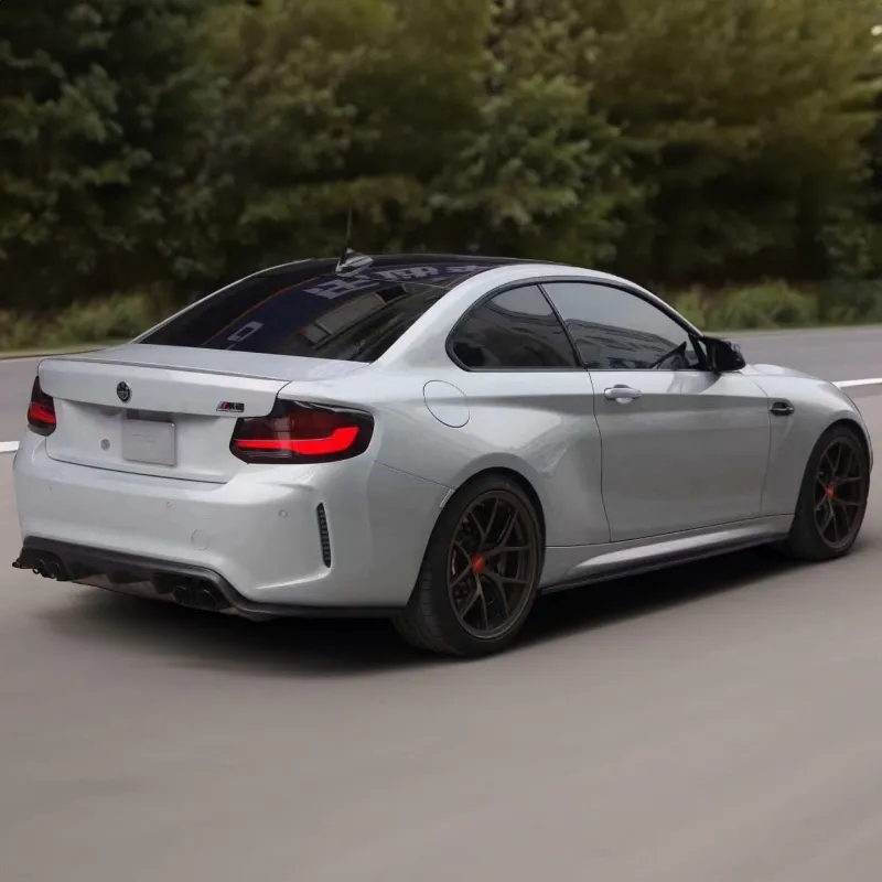 Twenty Two Tuning 3D Carbon Fiber Side Skirts compatible with BMW M2/M2C F87 showing gloss carbon fiber finish