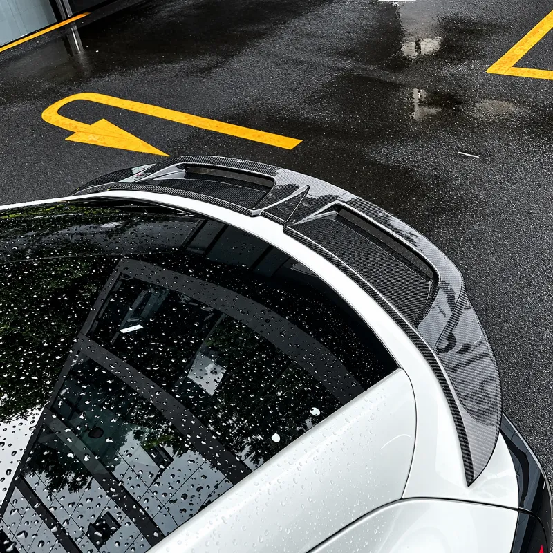 Tesstudio Carbon Fiber Hollow Rear Spoiler for Tesla Model Y Juniper showing full-width spoiler with dual open channel design