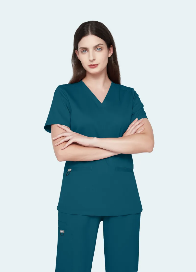 COMENII SoftTouch Essential Scrub Top in Caribbean Blue, front view