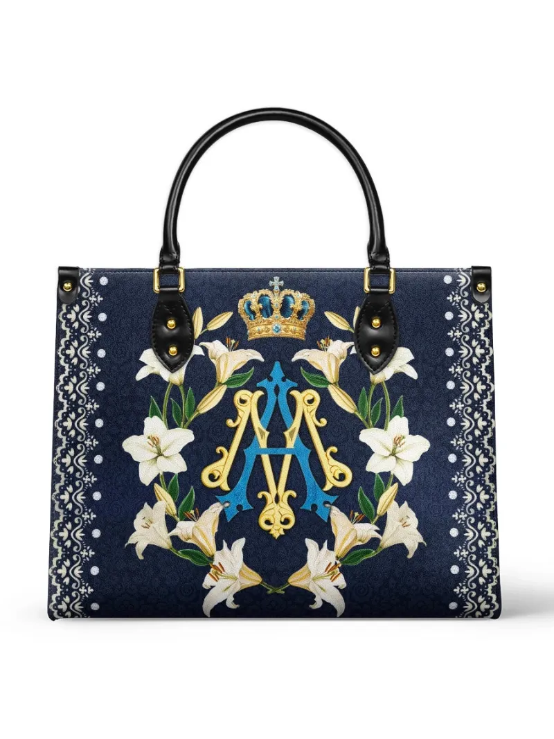 Catholight Crown Of Grace Leather Bag showing Marian monogram with crown and lilies on navy